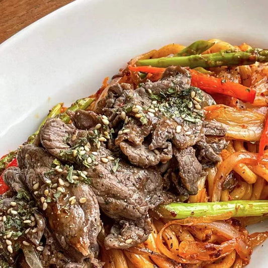 Tender Korean beef bulgogi on brown rice; savoury, sweet, and flavourful.